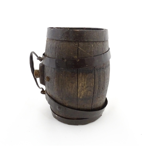 1165 - A Victorian coopered oak barrel with swing. With initials HFB to one end. Approx. 9