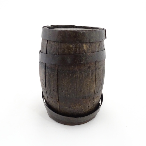 1165 - A Victorian coopered oak barrel with swing. With initials HFB to one end. Approx. 9