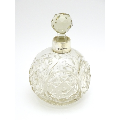 249 - A Victorian cut glass scent / perfume bottle with silver mounts hallmarked Chester 1897, maker Corne... 