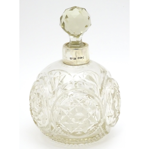 249 - A Victorian cut glass scent / perfume bottle with silver mounts hallmarked Chester 1897, maker Corne... 