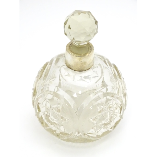 249 - A Victorian cut glass scent / perfume bottle with silver mounts hallmarked Chester 1897, maker Corne... 