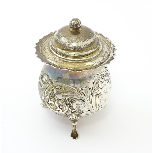 252 - A silver pot and cover with embossed decoration hallmarked Birmingham 1904, maker RR. Approx. 4