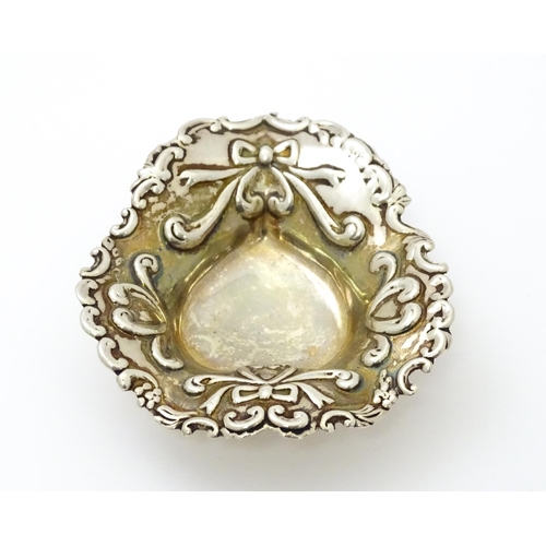 381 - A Victorian silver bonbon dish with embossed bow detail hallmarked Birmingham 1894, maker John Millw... 