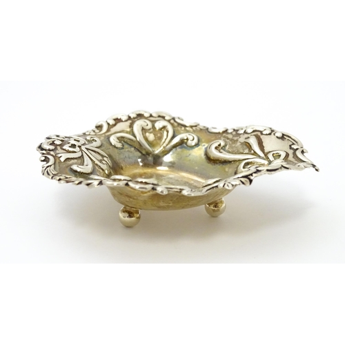 381 - A Victorian silver bonbon dish with embossed bow detail hallmarked Birmingham 1894, maker John Millw... 