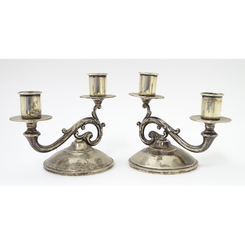 384 - A pair of American silver twin branch candlesticks. Marked under Fisher Sterling. Approx 4 3/4