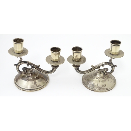 384 - A pair of American silver twin branch candlesticks. Marked under Fisher Sterling. Approx 4 3/4
