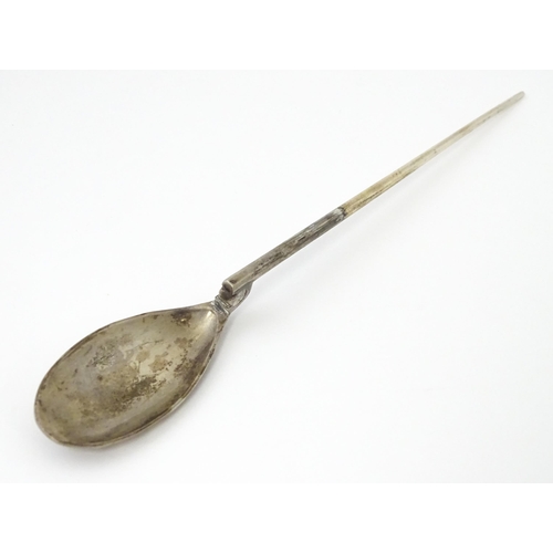 254 - A silver replica of a Roman Christening spoon, indistinctly marked. Approx. 8 1/4