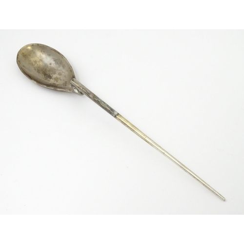 254 - A silver replica of a Roman Christening spoon, indistinctly marked. Approx. 8 1/4