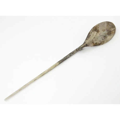 254 - A silver replica of a Roman Christening spoon, indistinctly marked. Approx. 8 1/4