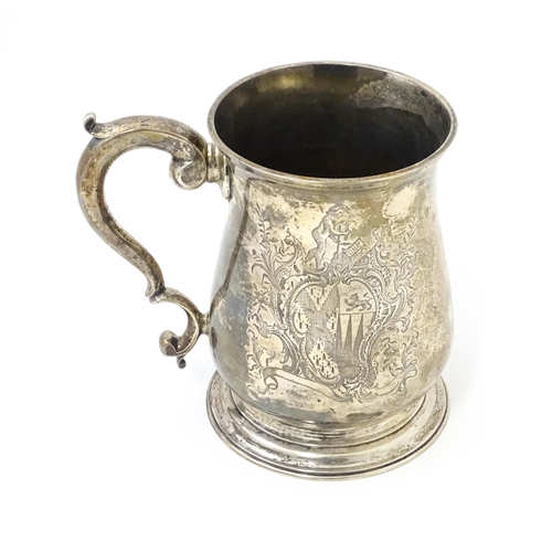 271 - A Geo II silver tankard / mug with engraved heraldic armorial coat of arms decoration hallmarked Lon... 