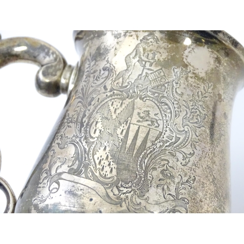 271 - A Geo II silver tankard / mug with engraved heraldic armorial coat of arms decoration hallmarked Lon... 