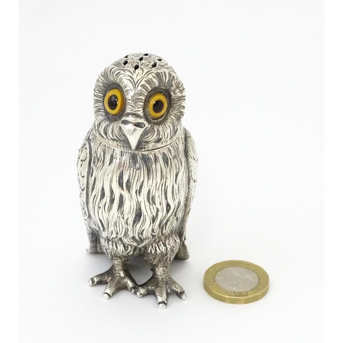 258 - A Victorian silver novelty pepperette modelled as an owl with glass eyes, hallmarked London 1853, ma... 