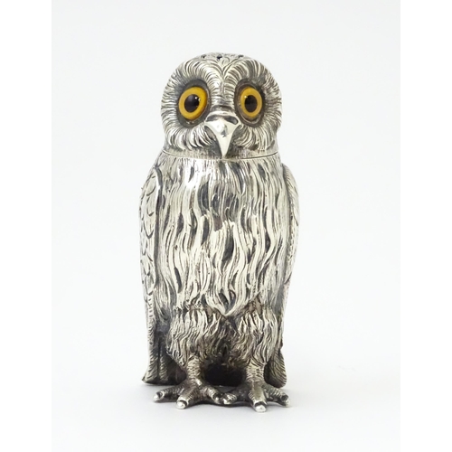 258 - A Victorian silver novelty pepperette modelled as an owl with glass eyes, hallmarked London 1853, ma... 