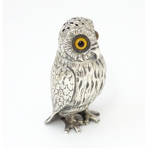 258 - A Victorian silver novelty pepperette modelled as an owl with glass eyes, hallmarked London 1853, ma... 