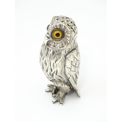 258 - A Victorian silver novelty pepperette modelled as an owl with glass eyes, hallmarked London 1853, ma... 