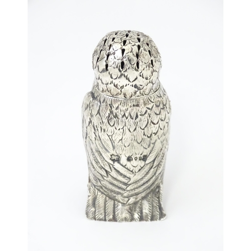 258 - A Victorian silver novelty pepperette modelled as an owl with glass eyes, hallmarked London 1853, ma... 