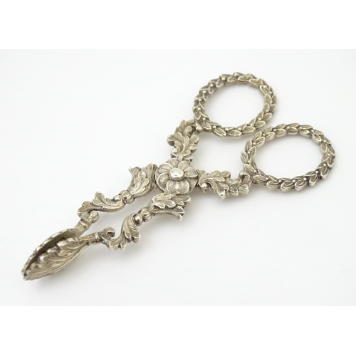 263 - William IV silver sugar nips with foliate detail and laurel chaplet formed handles, hallmarked Birmi... 