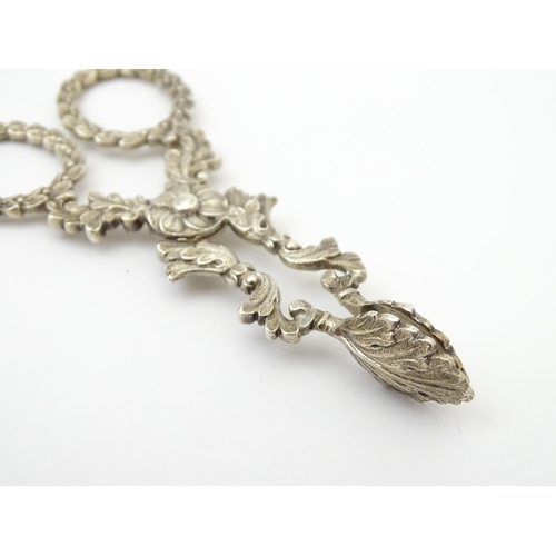 263 - William IV silver sugar nips with foliate detail and laurel chaplet formed handles, hallmarked Birmi... 