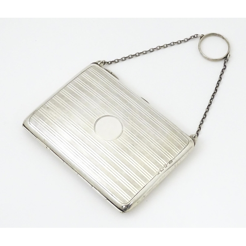 353 - A silver purse / dance card case with leather lined interior. Hallmarked Birmingham, 1915 maker Harr... 