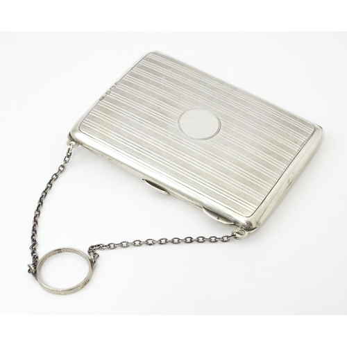 353 - A silver purse / dance card case with leather lined interior. Hallmarked Birmingham, 1915 maker Harr... 