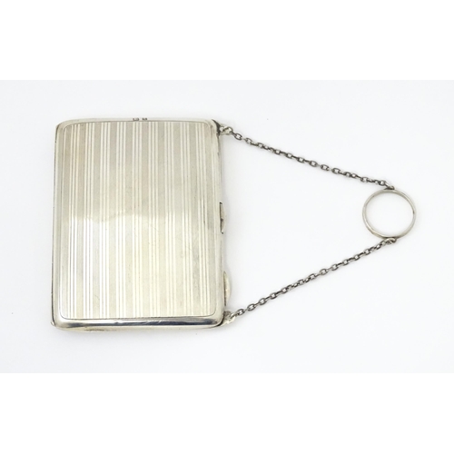 353 - A silver purse / dance card case with leather lined interior. Hallmarked Birmingham, 1915 maker Harr... 