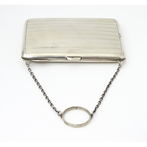 353 - A silver purse / dance card case with leather lined interior. Hallmarked Birmingham, 1915 maker Harr... 