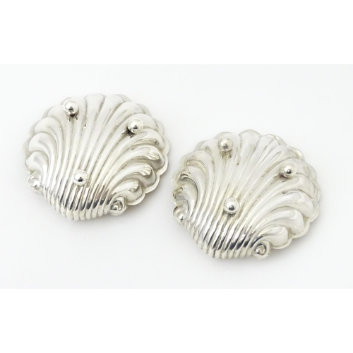 358 - A pair of silver salts of scallop shell form with gilded interiors with two salt spoons. All hallmar... 