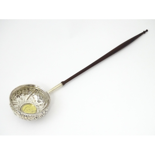 363 - A white metal punch ladle with coin style detail to bowl.  Approx 11