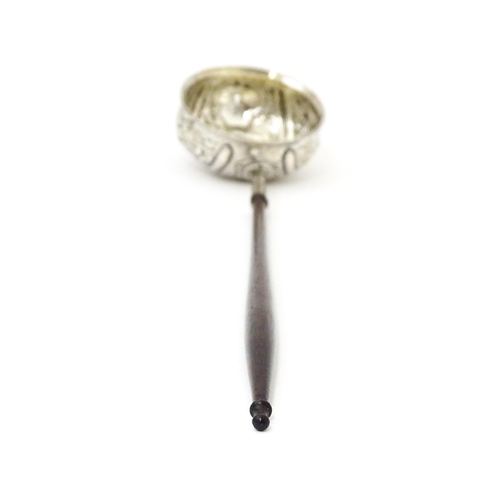 363 - A white metal punch ladle with coin style detail to bowl.  Approx 11