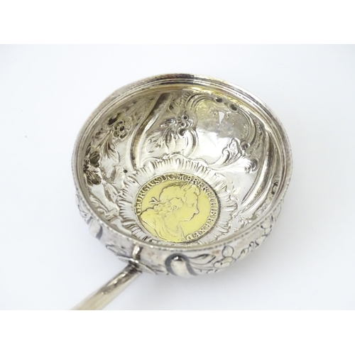 363 - A white metal punch ladle with coin style detail to bowl.  Approx 11