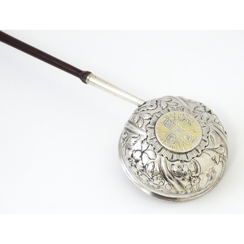 363 - A white metal punch ladle with coin style detail to bowl.  Approx 11