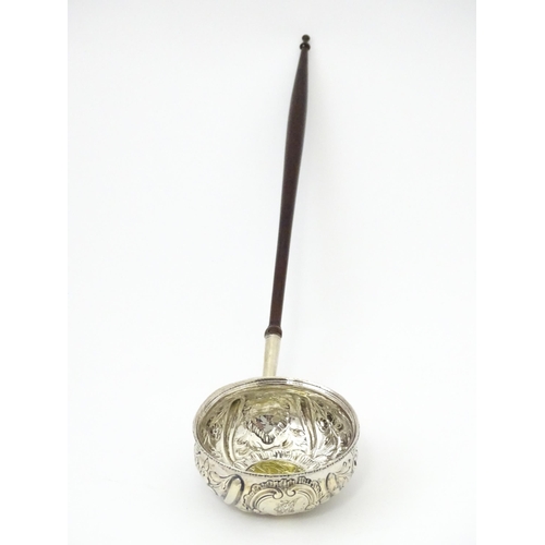 363 - A white metal punch ladle with coin style detail to bowl.  Approx 11