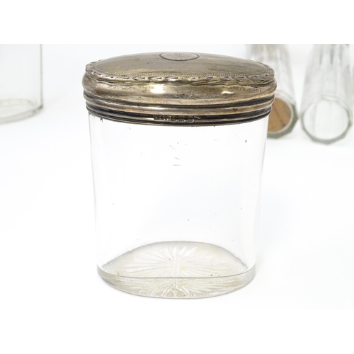 369 - Seven assorted Victorian and later glass and silver topped dressing table pots / jars, to include an... 