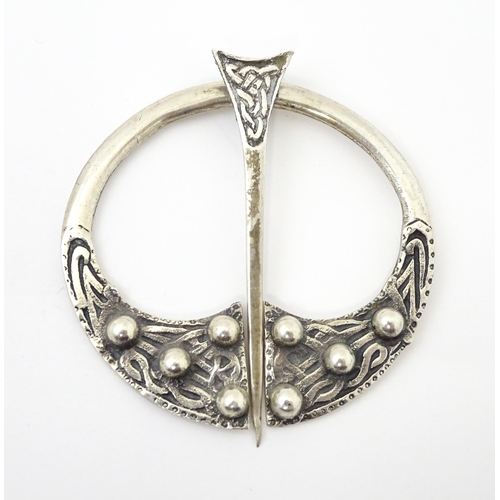 733 - A Scottish silver penannular brooch / pin with Celtic decoration.  Hallmarked  Glasgow 1941 maker He... 