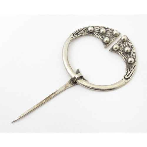 733 - A Scottish silver penannular brooch / pin with Celtic decoration.  Hallmarked  Glasgow 1941 maker He... 