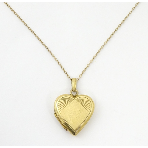 736 - A 9ct gold pendant locked of heart shape, together with a 9ct gold chain. The chain approx 16