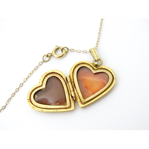 736 - A 9ct gold pendant locked of heart shape, together with a 9ct gold chain. The chain approx 16