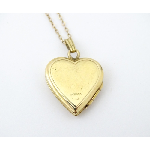 736 - A 9ct gold pendant locked of heart shape, together with a 9ct gold chain. The chain approx 16