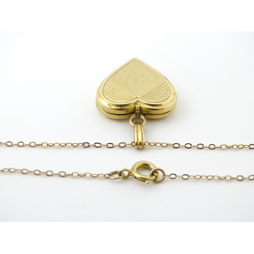 736 - A 9ct gold pendant locked of heart shape, together with a 9ct gold chain. The chain approx 16