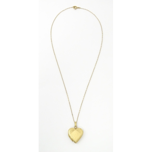 736 - A 9ct gold pendant locked of heart shape, together with a 9ct gold chain. The chain approx 16