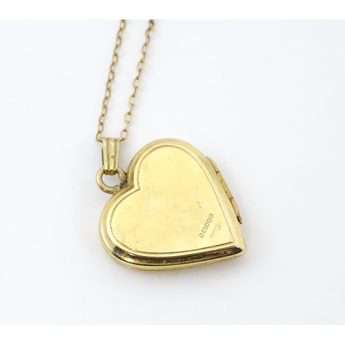 736 - A 9ct gold pendant locked of heart shape, together with a 9ct gold chain. The chain approx 16