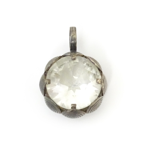 737 - A Scandinavian silver pendant set with facet cut white stone to centre. Stamped with anvil mark for ... 