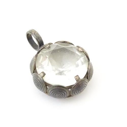 737 - A Scandinavian silver pendant set with facet cut white stone to centre. Stamped with anvil mark for ... 