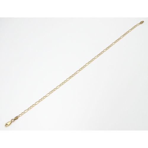 744 - A 9ct gold anklet / large bracelet. Approx 9