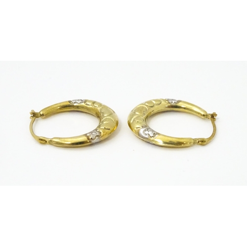 751 - A pair of 9ct gold hoop earrings. Approx. 3/4