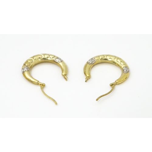 751 - A pair of 9ct gold hoop earrings. Approx. 3/4