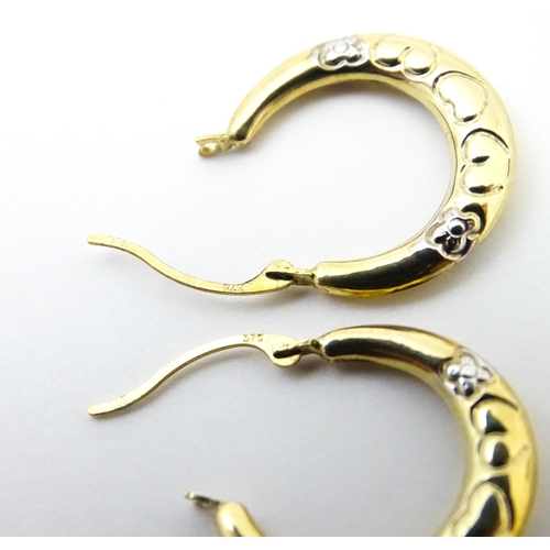 751 - A pair of 9ct gold hoop earrings. Approx. 3/4