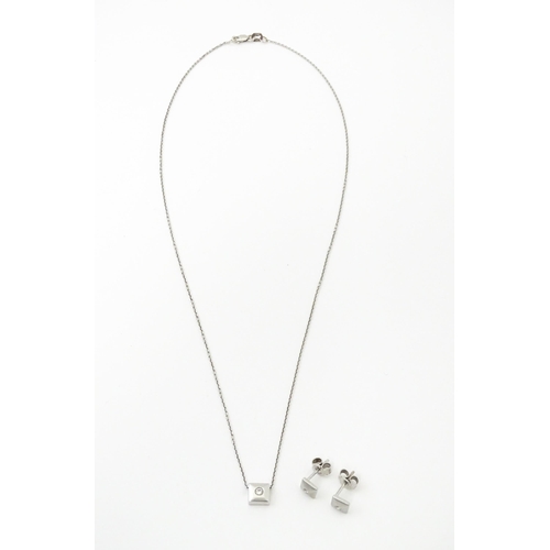 759 - An 18ct white gold chain necklace with diamond set pendant together with matching stud earrings. nec... 