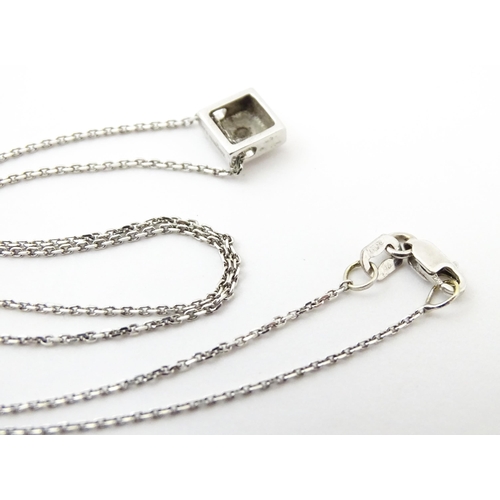 759 - An 18ct white gold chain necklace with diamond set pendant together with matching stud earrings. nec... 