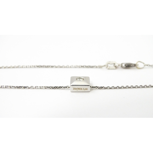 759 - An 18ct white gold chain necklace with diamond set pendant together with matching stud earrings. nec... 